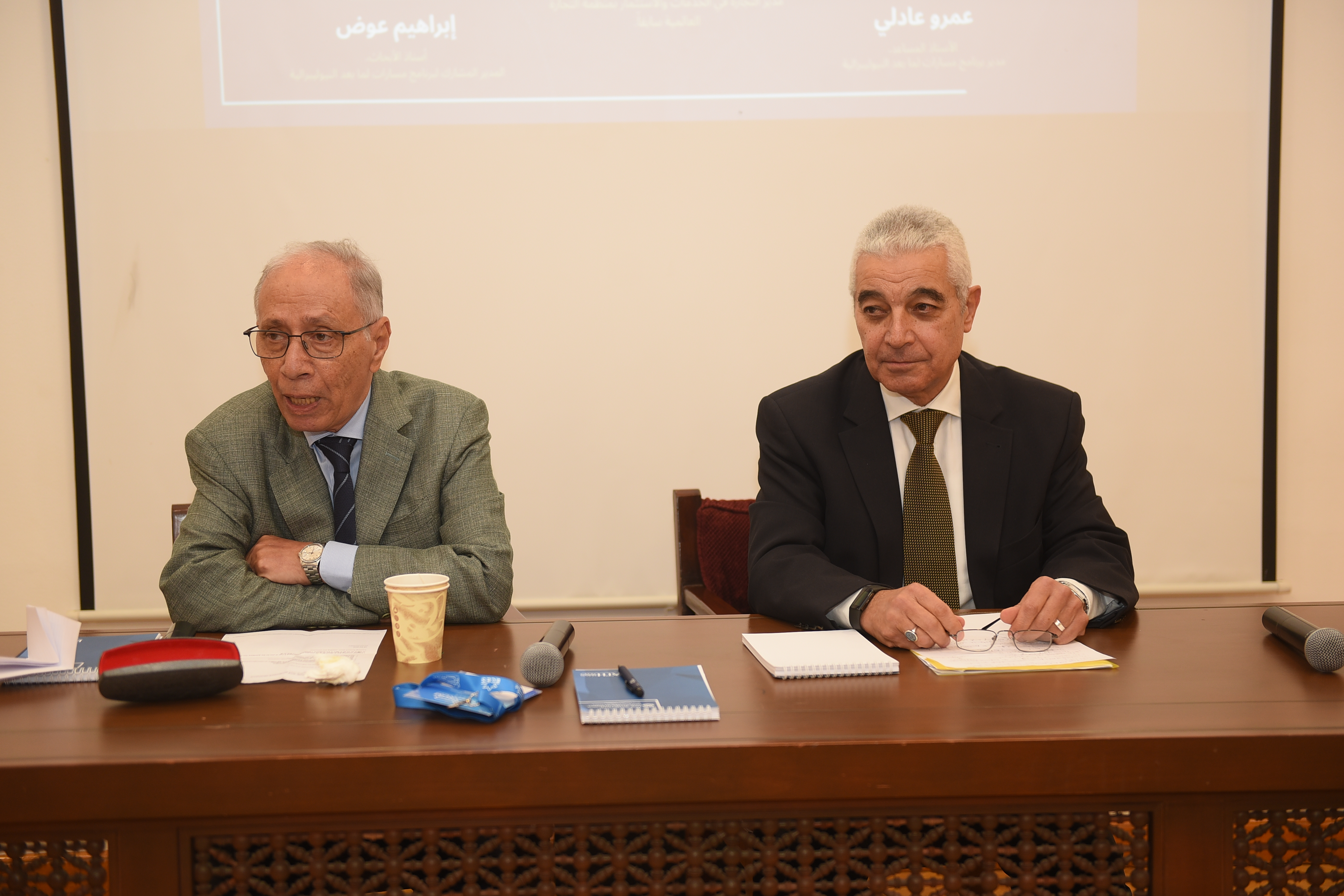 Global trading system event attendees chatting after the panel