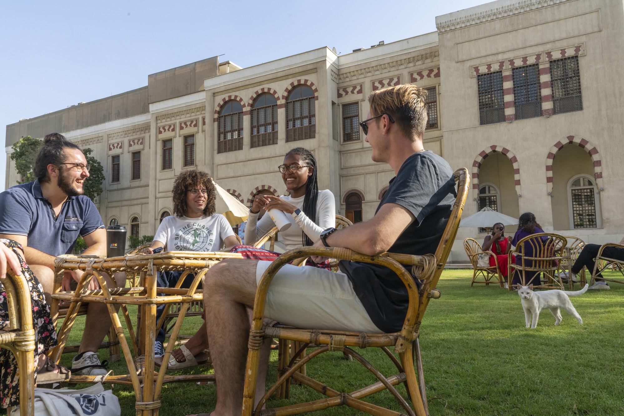 international students talking together in auc gardens in tahrir 