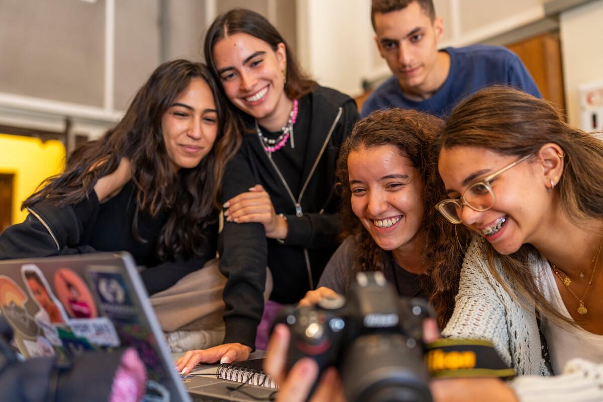 students working with camera and project together