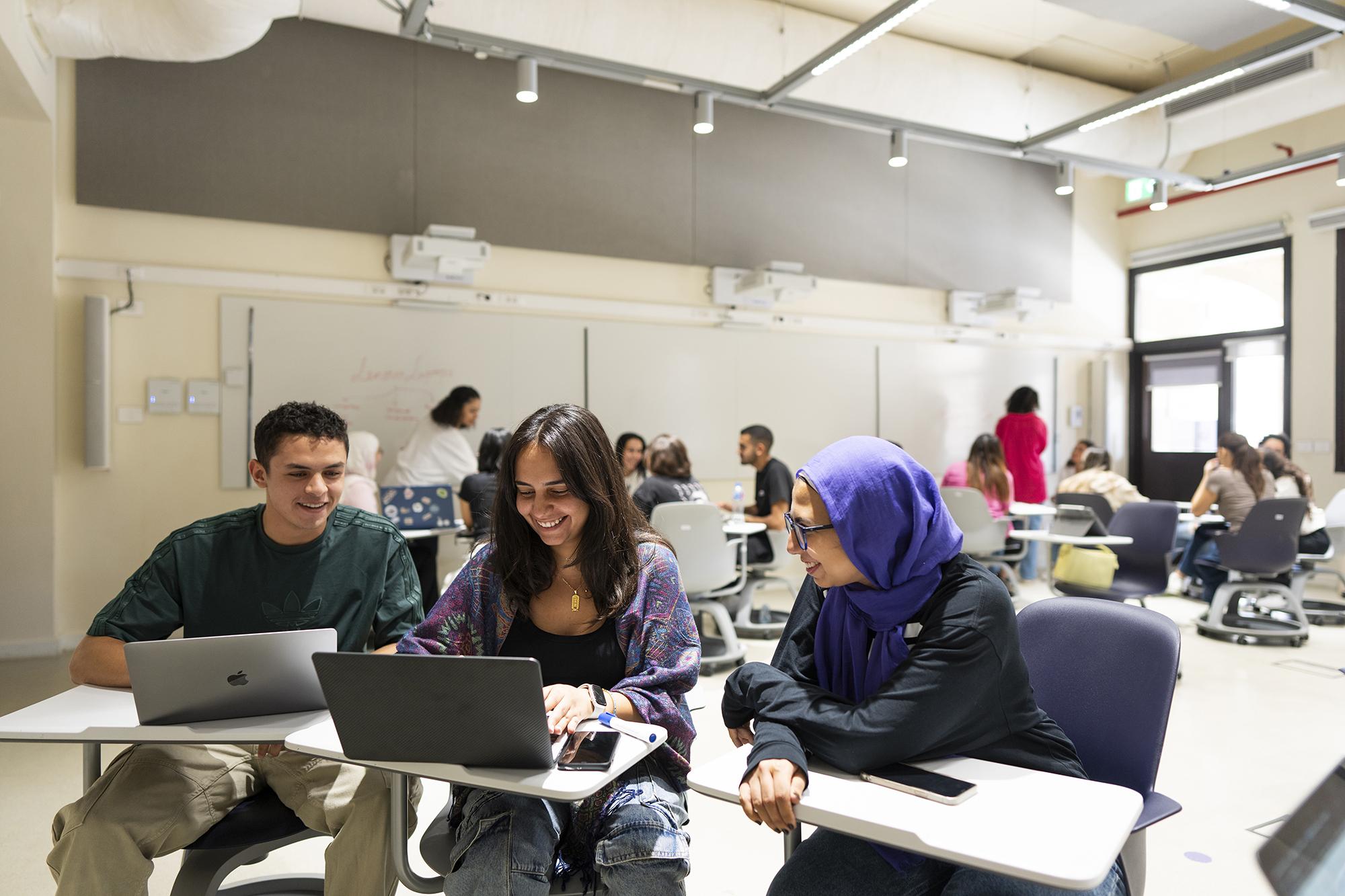 students working together in class on project