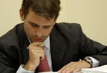 corporate student writing a research