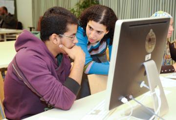 male and female student working in computer lab