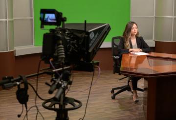studio on camera presenting news