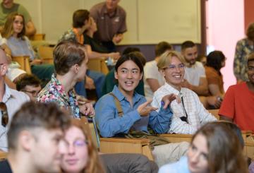 international students attending an event in a hall