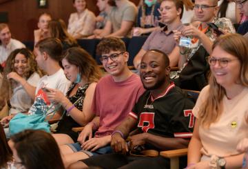 Group of international students in hall smiling