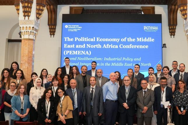 pathways event with AUC president taking a group photo with attendees