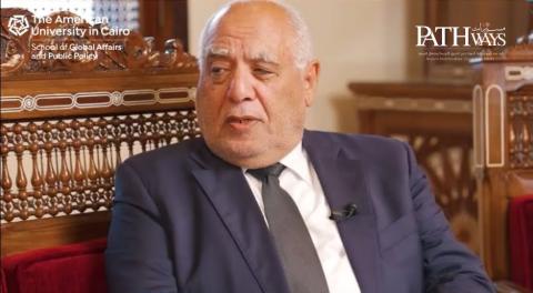 A man is sitting and talking
