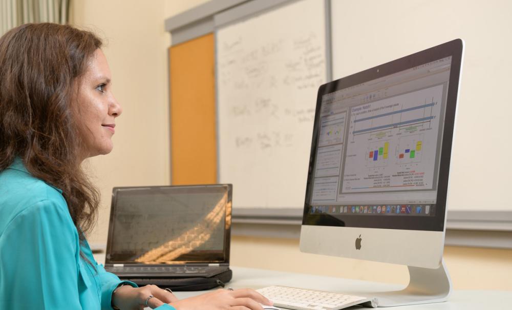 student researching on a computer
