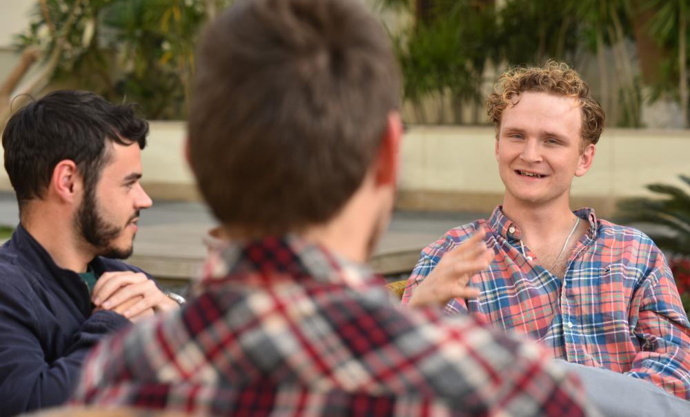 international student in auc garden talking with other students