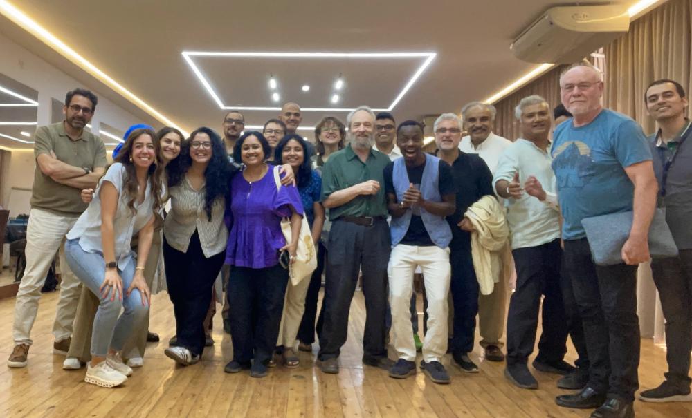 Groupt of attendees taking photos together