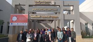 students standing in front of the shelter after their CASAR academic trip
