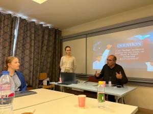 during debate students talking and interacting on round table