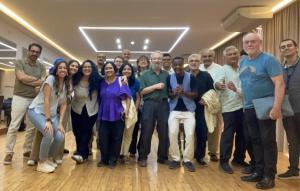 Groupt of attendees taking photos together