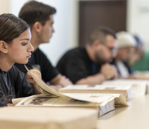 students in class checking caravan