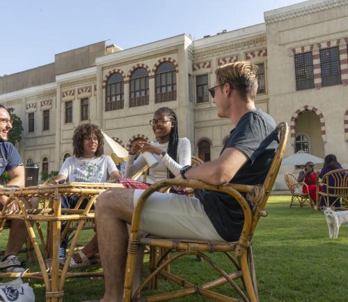 international students talking together in auc gardens in tahrir 