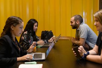 2 college employees providing advice to students