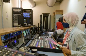 student working on digital equipment in JRMC studio