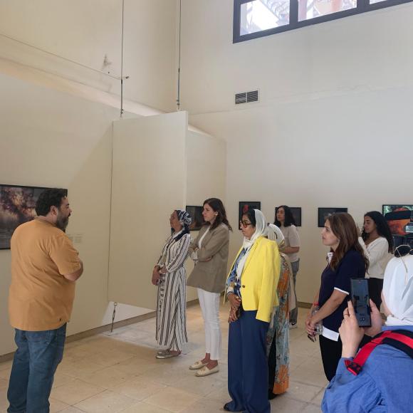 visitors given a tour at photo exhibition