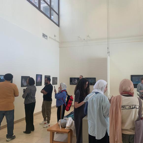 visitors given a tour at photo exhibition